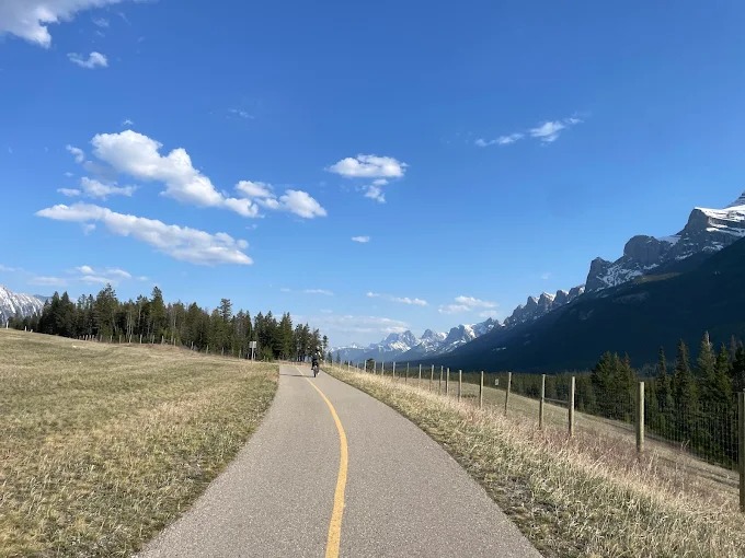 Legacy Trail in spring with the Three Sisters rising ahead
